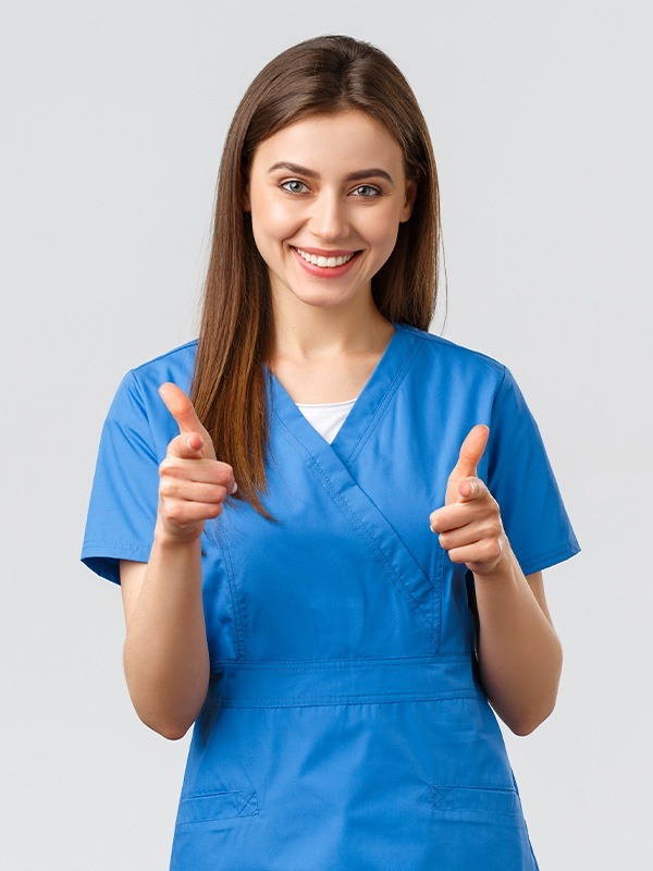 Image highlighting NYHC's Private Duty Nursing service: Our dedicated nurse standing, giving a thumbs-up with a smile, symbolizing quality care in private nursing services.
